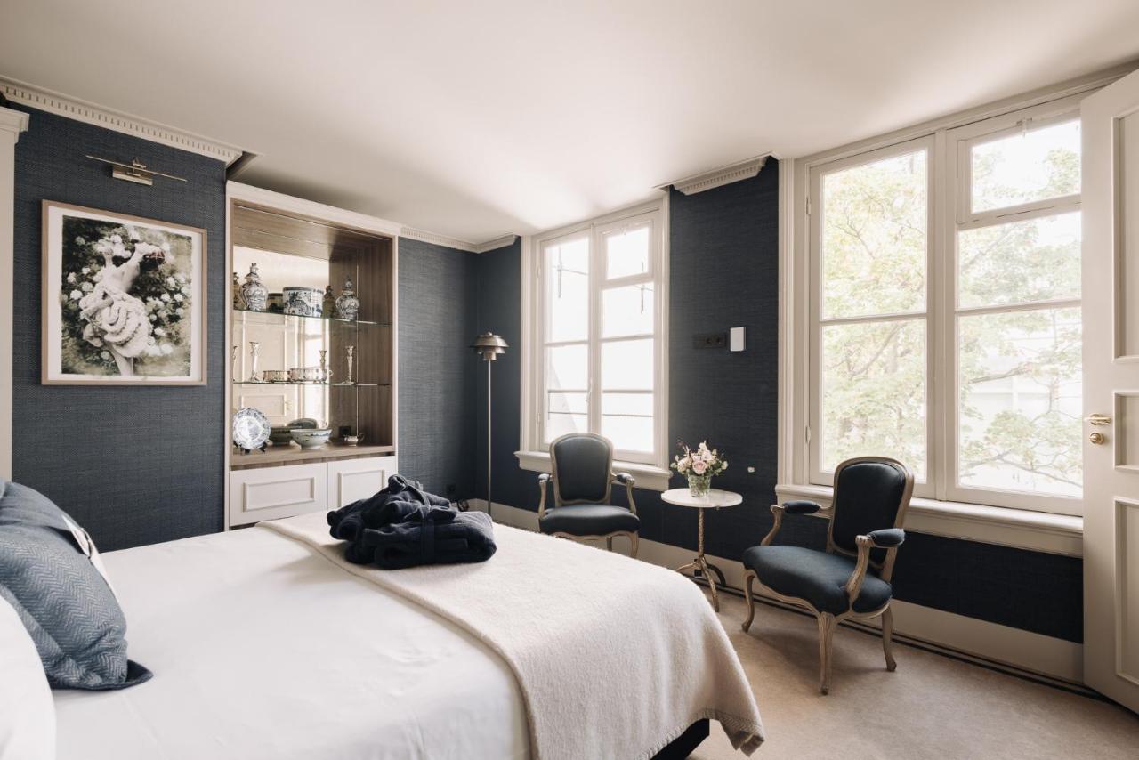 Hotel 717 Amsterdam Bagian luar foto A bedroom at The Ivy Hotel
