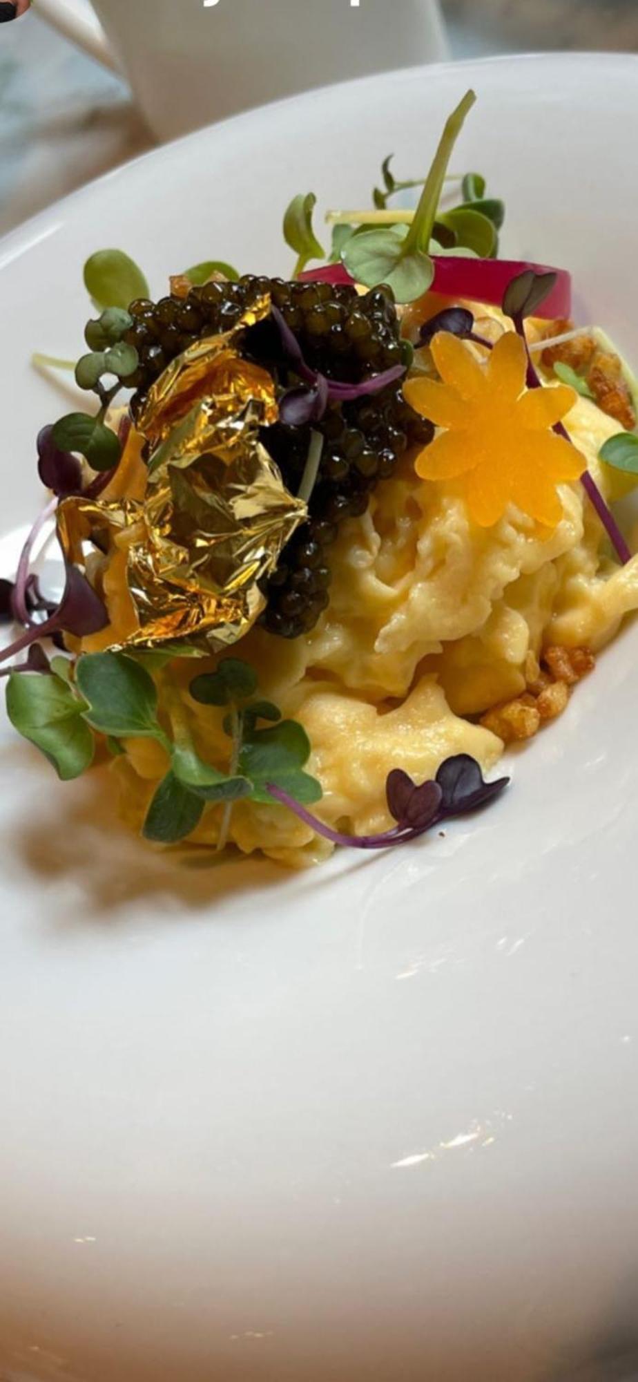 Hotel 717 Amsterdam Bagian luar foto A close-up of a dish of risotto with gold leaf